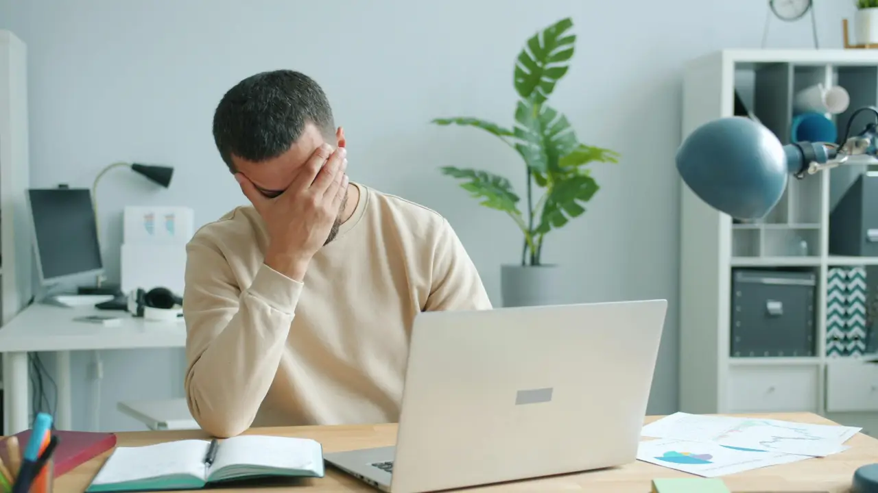 Employee showing burnout in office